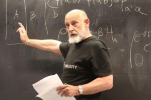 Leonard Susskind lecturing in front of a blackboard